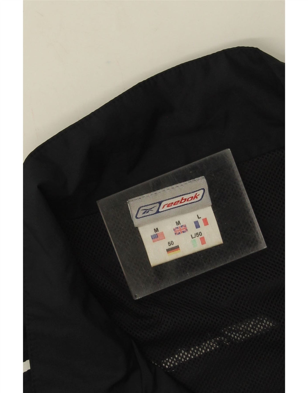 Reebok Chaqueta de chándal holgada para hombre con bloques de color negro mediano