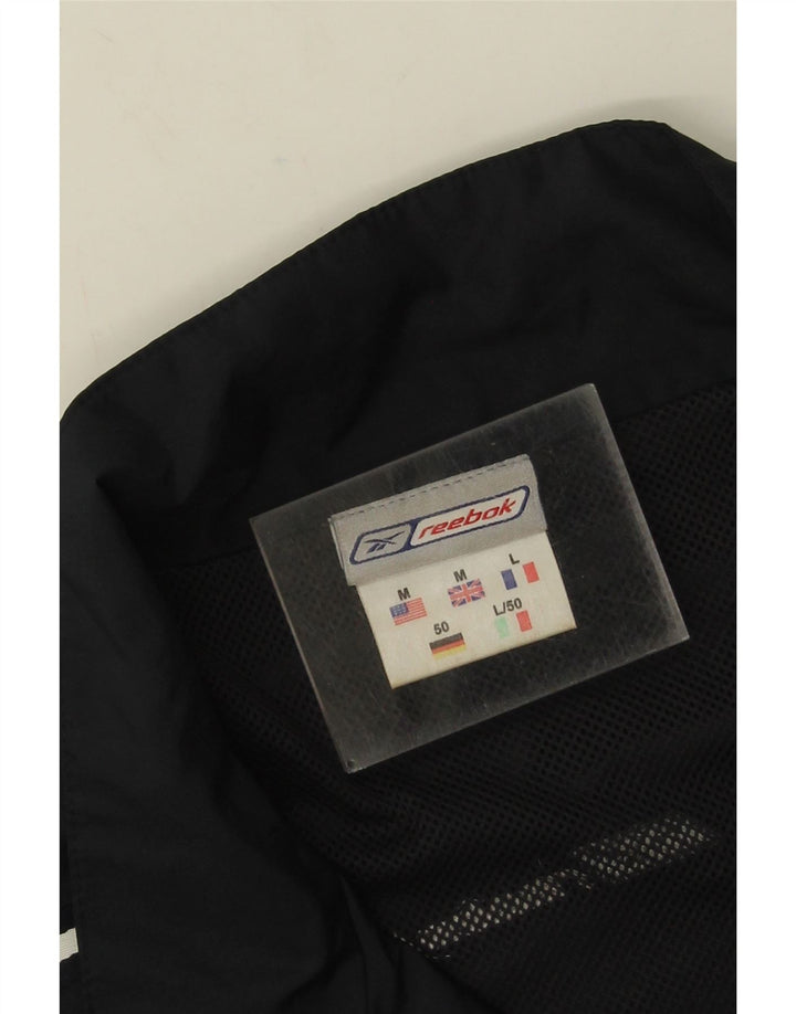 Reebok Chaqueta de chándal holgada para hombre con bloques de color negro mediano